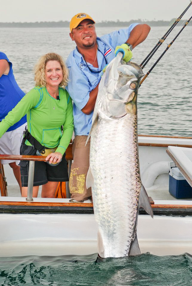 Tarpon fishing success with a trophy-class fish displayed by a guided angler on a boat in Costa Rica.